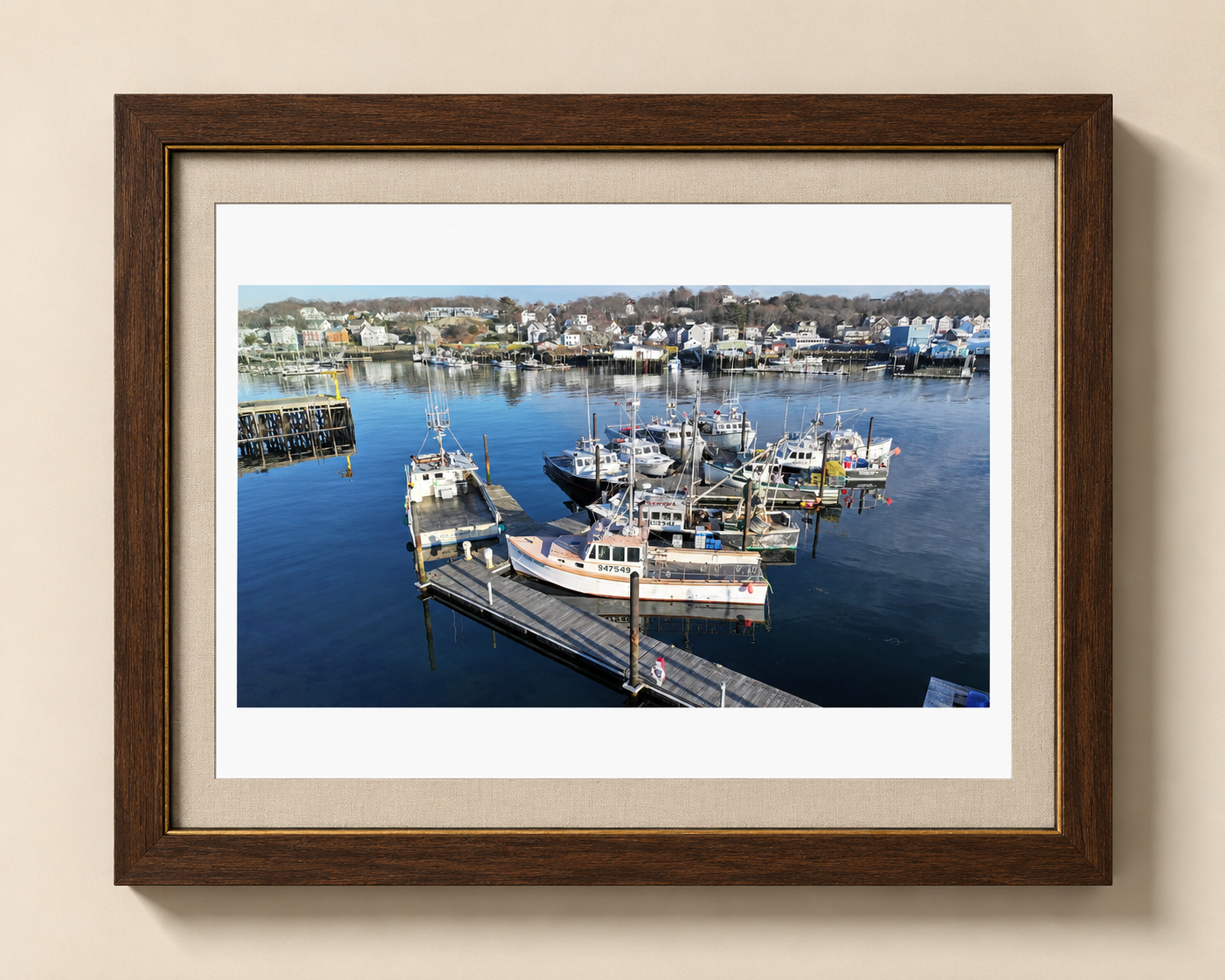 Working Harbor fine-art photograph shown with its full paper margin in a bespoke black walnut, gold bead, and oatmeal linen frame